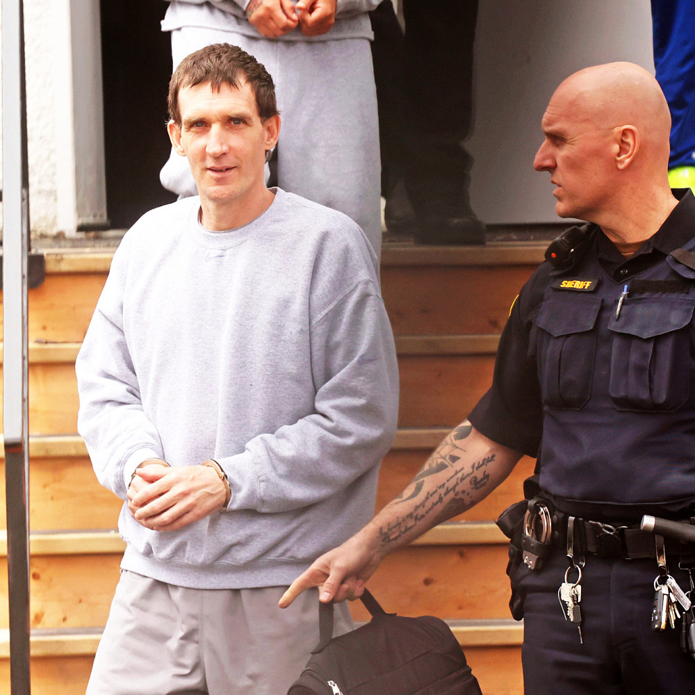 Michael Man of Russell is escorted out of provincial court at the Rossburn Community Hall by sheriffs on Wednesday after a sentencing hearing. Man, 46 was previously convicted of uttering threats and later pleaded guilty to three additional counts.