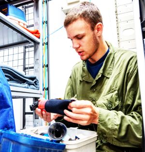 Cadet Flight Sergeant Levi Layh inspects a bear safety kit, checking its condition and ensuring expiry dates are valid, at Cold Lake Cadet Training Centre in Cold Lake, Alberta on July 9, 2026