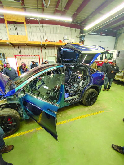 Firefighters equip themselves with  knowledge of new automotive technology